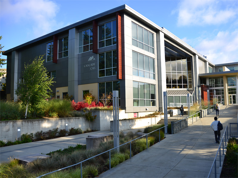 students walking in front of the cascade building