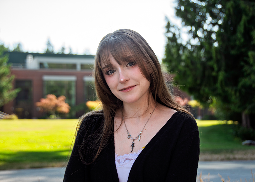 female student wearing black sweater poses at Pierce College Puyallup