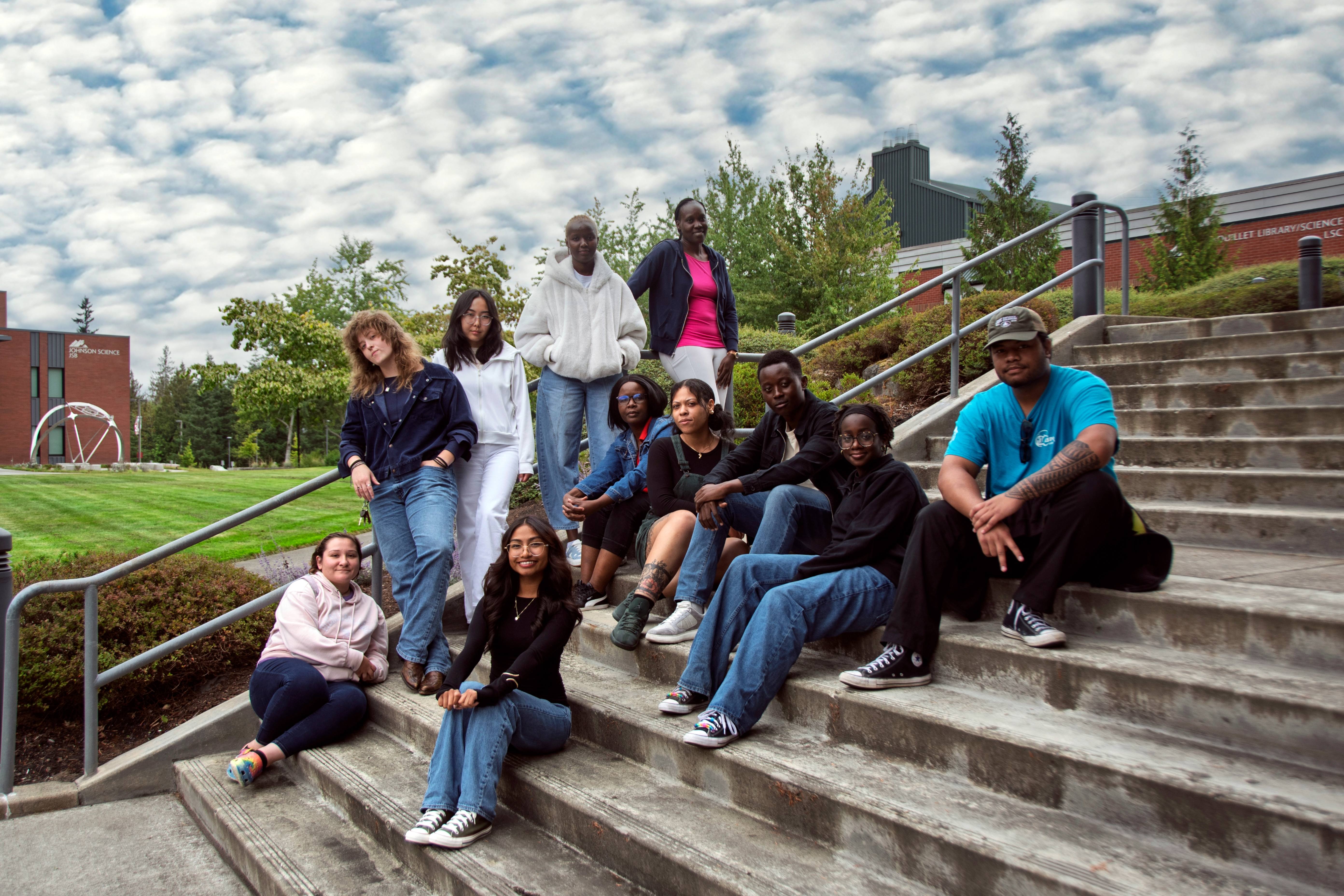 Fort Steilacoom Office of Student life 2025-2026 team sits scattered across a set of stairs