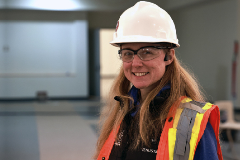 student in hard hat and construction vest