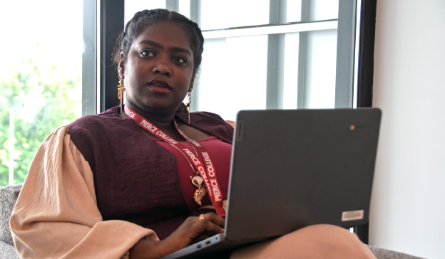 student sitting with laptop