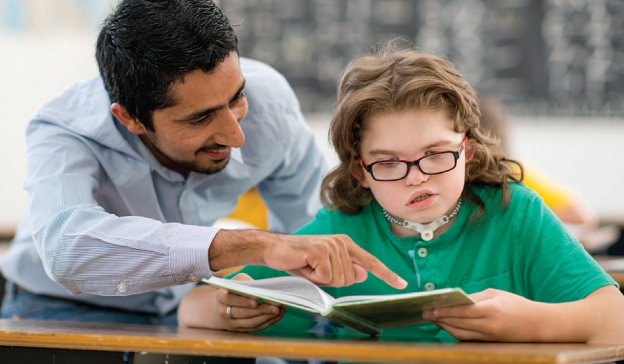 Paraeducator working with a grade school student.